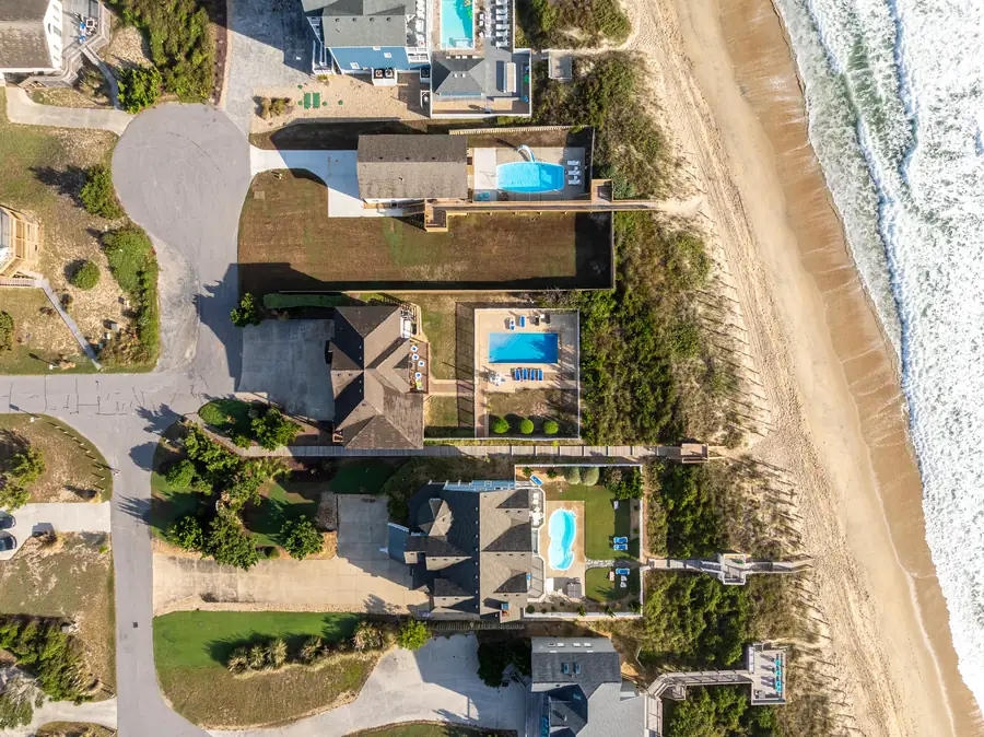 Straight-down drone shot of oceanfront homes